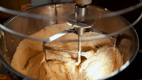 Industrial mixer for kneading dough. Top view of large stand machine used in commercial bakery to mix bread dough.