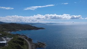 Panoramic drone shot of ocean view. Aerial video shot by drone in Scotland, highland landscape.