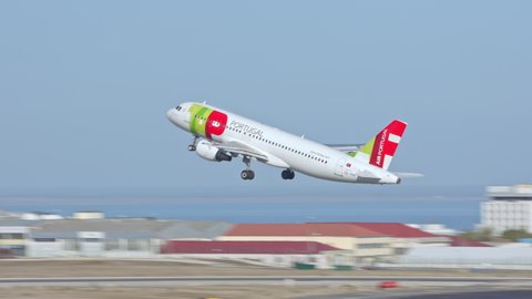 LISBON, PORTUGAL - 2020: TAP Air Portugal Airbus A320 Jet Airliner Taking Off Departing Lisbon Portugal Humberto Delgado Portela International Airport Runway Flying into a Blue Sky on a Sunny Day