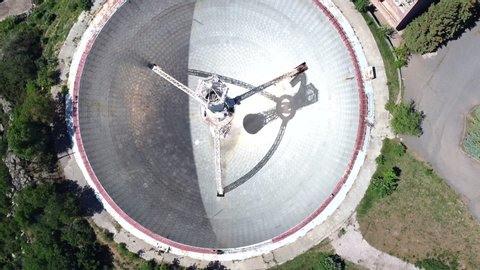 Aerial View of Radio-Optical Telescope, Giant Radio Astronomical Telescope surrounded by mountains. Drone fly over huge Orgov Radio-Optical Telescope in Armenia