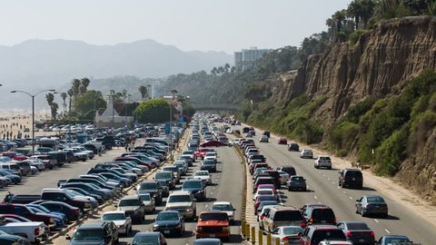 SANTA MONICA - MAY 25, 2014: freeway with cars commuting, commuters driving in traffic in Santa Monica near beach ocean in LA. Santa Monica is an oceanfront city in Los Angeles, California.