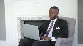 Young black business man communicating by video call. Ethnic businessman speaking looking at laptop computer, online conference distance office chat, virtual training concept.