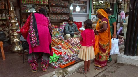 Varanasi, India - Circa October 2019. Customers in the jewelry street shop.