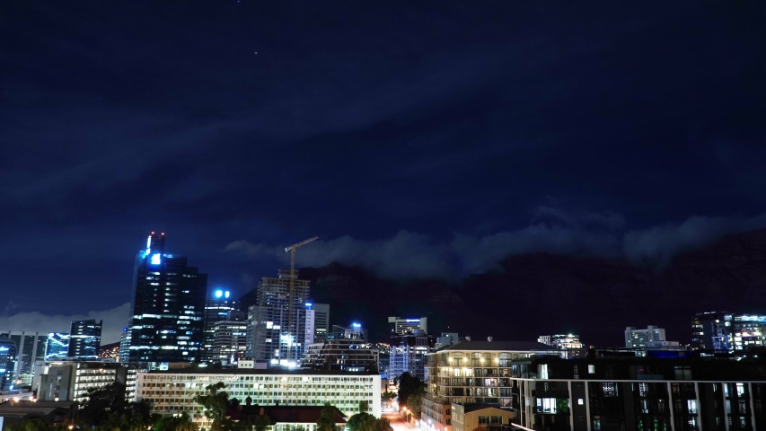 Timelapse: Cape Town City Bowl at Night with Cloudy Table Mountain in Background