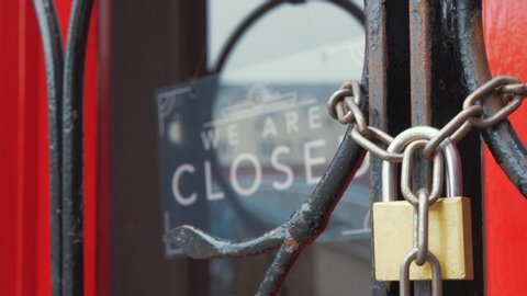 Closed restaurant sign locked entrance Corona virus disease 4K