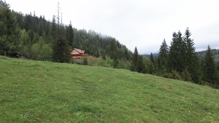 Ukraine, Carpathian Mountains: House in the mountains Aerial.