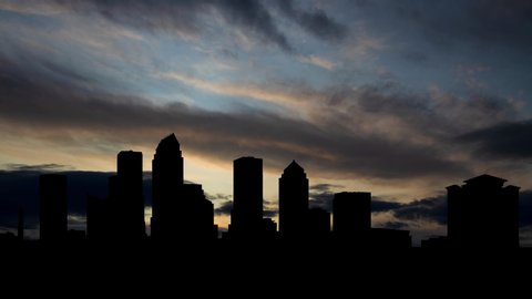Tampa Skyline,Time Lapse at Sunrise with Fast Clouds and Dark Silhouette of Skyscrapers, Florida, USA