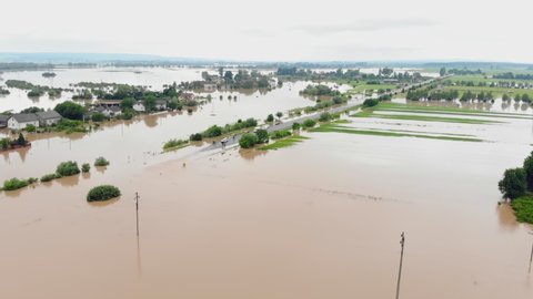 Aerial view river that overflowed after heavy rains and flooded agricultural fields