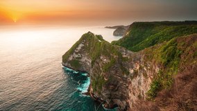 Top view at nature landscape with sand beach sea and rocks. Amazing mountain cliff in the azure ocean water against the backdrop of beautiful tropical nature. Bali, Indonesia