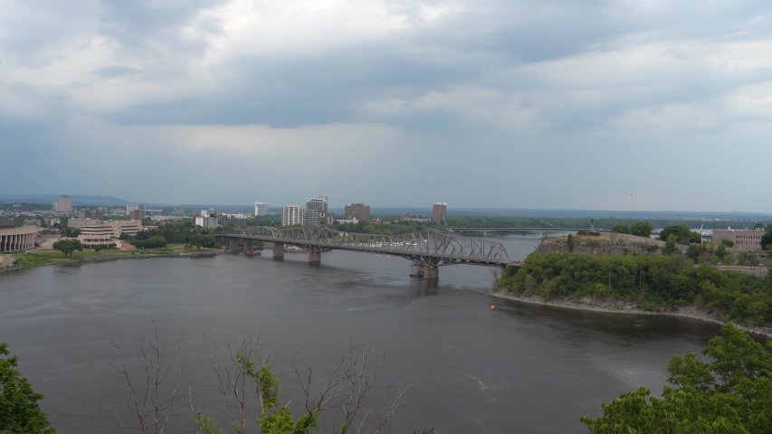 Aerial view of the Alexandra bridge, Gatineau and the Ottawa river in an overcast summer day