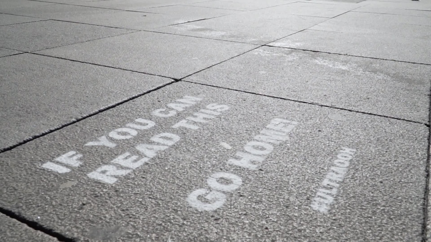 Strong Sprayed Message on Street during Global Corona Crisis in Europe