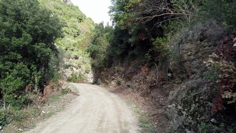 Offroad rural road drive pov at Mount Athos, Greece. The Holy Mountain Athos in Greece has been listed as a World Heritage Site.