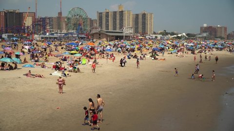 New York NY/USA-July 5, 2020 Thousands of beachgoers generally observe social distancing as they try to beat the heat and humidity at Coney Island in Brooklyn in New York