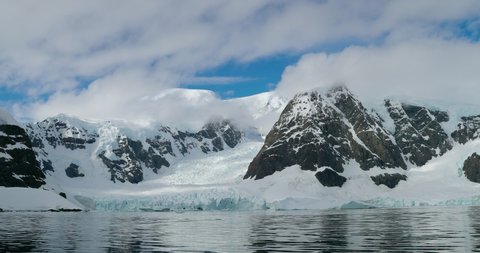 WS Snow covered mountains and glacier surrounding bay / Sanaviron Peninsula, Antarctica