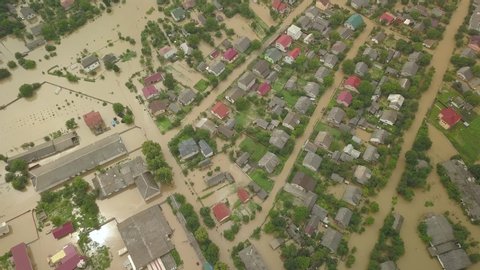 The flooded city of Halych from a height. Flood in Ukraine 06.24.2020. The Dniester River overflowed due to heavy rainfall and flooded houses and roads. Aerial video