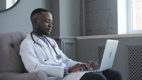 an African American doctor provides Telemedicine consultations through the transmission of medical information via telecommunications channels