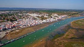Video shooting aerial, the Ria Formosa canal of the village Cabanas de Tavira. Water tourism and traditional fishing. Portugal Algatrve.