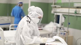 Female nurse with medical uniform and Hijab treat a man with face mask. Novel Coronavirus (COVID-19) hospitalization. woman doctor with protective gear checkup a patient with corona virus disease. - Powered by Shutterstock - Get 15% off with code: PIKWIZARD15