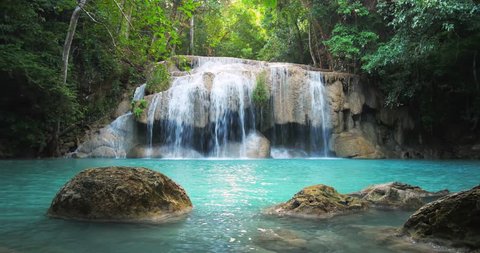 Scenic waterfall in Thailand tropical forest. Beautiful nature loopable seamless background