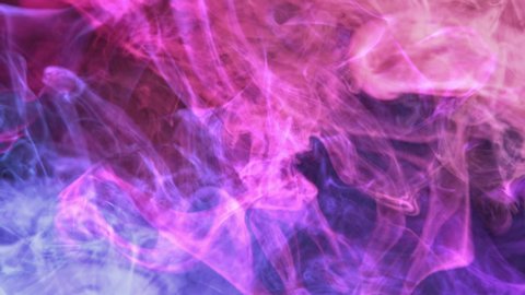 Color vapor background. Hot cold. Neon pink blue glowing smoke mix motion on dark.