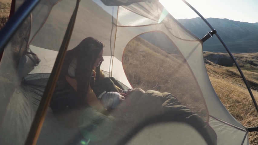 People inside the tent. on a mountainside in Montenegro mooving camera