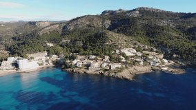 Aerial view of Mallorca island, Baleares, Spain. 4K footage of beautiful landscape, Mediterranean sea, green mountains, turquoise water, beaches, resort coastline. Sant Elm