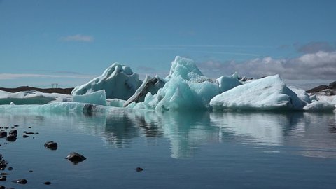 Iceland. Pieces of ice on the shore from melting icebergs of Jokulsarlon glacier lagoon. Global warming and climate change concept.