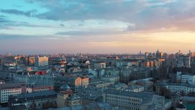 The center of historical Moscow mixed with modern architecture with a beautiful multi-colored sunset, the drone shoots video in Moscow.