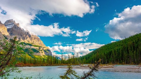 River Bend Dual Pine Banff Mt. Wilson Jasper National Park Time Lapse Brilliant blue skies and vivid green and yellow trees in the autumn colors of Banff National Park Time Lapse 4k