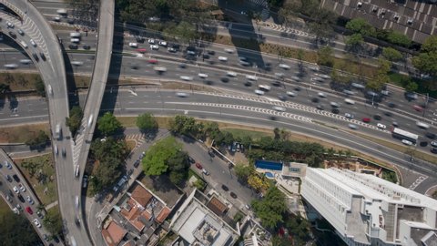  4K UHD Hyperlapse aerial drone footage of motorway 23 de maio in Sao Paulo, over Cebolinha junction, in a sunny day. Long exposure city life and transportation, concept background.