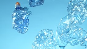 Super Slow Motion Shot of Flying Empty Plastic Waste on Blue Gradient Background at 1000fps. - Powered by Shutterstock - Get 15% off with code: PIKWIZARD15