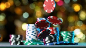 Poker chips falling on casino table in super slow motion, filmed on high speed cinema camera at 1000 fps. Gambling background. - Powered by Shutterstock - Get 15% off with code: PIKWIZARD15
