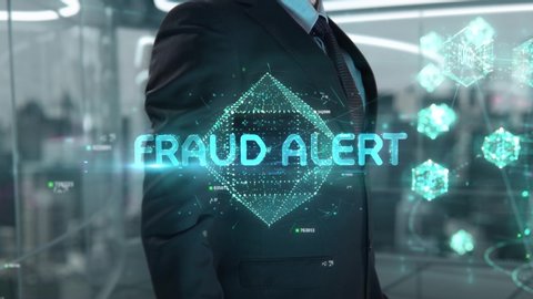 Businessman with Fraud Alert hologram concept