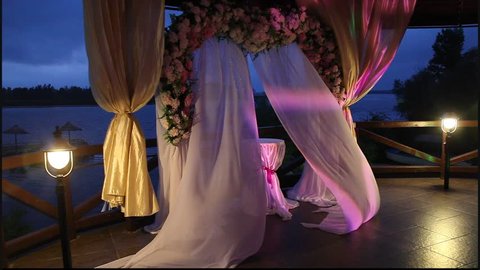 Arch for wedding ceremony, the curtain in the wind