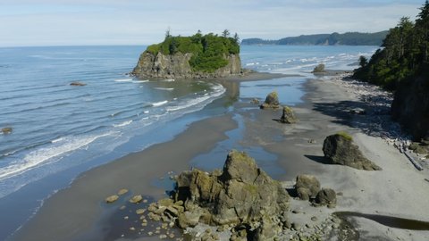 Aerial, Drone Flies Along Ruby Beach in Olympic National Park, Washington on Summer Afternoon, Blue Skies