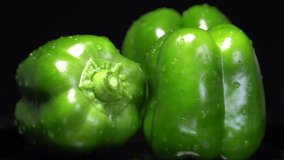 Fresh green wet bell peppers close up rotation - Powered by Shutterstock - Get 15% off with code: PIKWIZARD15