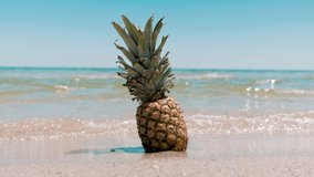 Pineapple on the beach. Pineapple fruit in the sea waves. Leisure in summer and Summer vacation concept.  - Powered by Shutterstock - Get 15% off with code: PIKWIZARD15