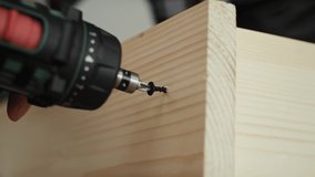 Detail video of screwing with cordless screwdriver. Shot with RED helium camera in 8K
