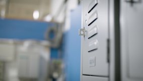 A warehouse employee gets back to work. Essential and frontline worker gets ready for his shift. Shot in 4k.  - Powered by Shutterstock - Get 15% off with code: PIKWIZARD15