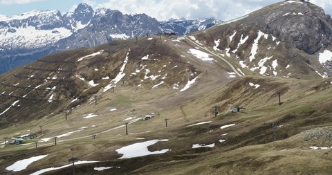 Selva Val Gardena, Italy - June 1.2020: Ski resort in spring, empty slopes on a hill above Val Gardena in the Alps