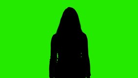 Video of shrugging woman's silhouette on chroma key