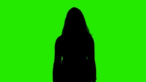 Video of woman's silhouette with pistol on chroma key