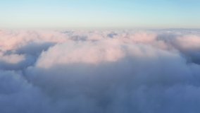 4K aerial of heavenly beautiful clouds at the sunrise. Background for christian religion concept video. Slow motion of white clouds in the sky. Drone is flying like a spirit. B Roll footage cloudscape