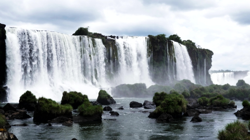 Iguazu Falls Waterfall in South America, 7 wonders of the world in Argentina province of Misiones and the Brazilian state. Royalty-Free Stock Footage #1055686964