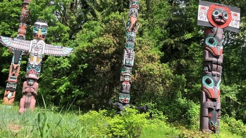Total Poles First Nations Art in Stanley Park - overview of all totem poles - left to right