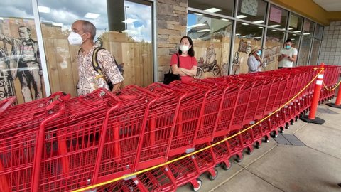 Montgomerty County, MD ,USA 07/10/2020:To limit spread of COVID-19, US groceries put up regultions. Customers are waiting in line with social distancing and face masks before entering store. 