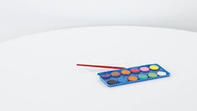 Office and school supplies on white table background.