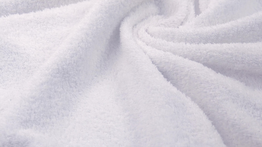Towel texture closeup. Soft white cotton towel backdrop, fabric background. Terry cloth bath or beach towels. Macro. 4K UHD video, slow motion | Shutterstock HD Video #1055738294