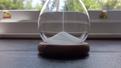 Sand hour glass timer on a desk
