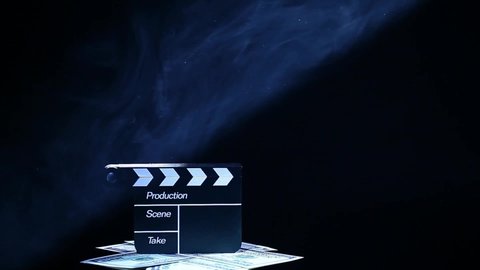  footage of clapper board money smoke dark background 